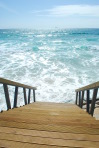 Wooden stairs or path to the bright ocean