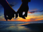 lover holding hand walking on the beach